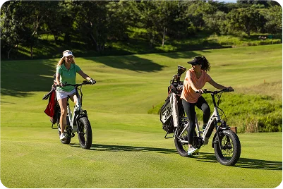 Two e-bikes on golf course